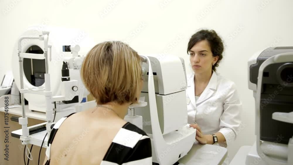 Ophthalmologist checks woman's eyes Ophthalmologist checks woman's eyes