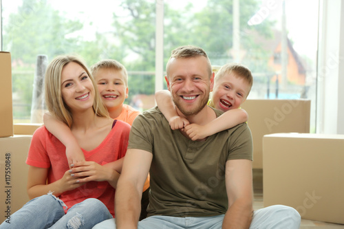 Happy family with cardboard...