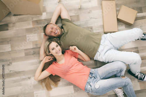 Beautiful couple lying on w...
