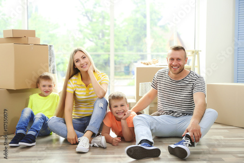 Happy family with cardboard...