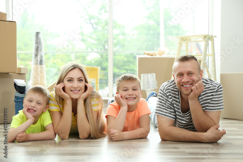 Happy family with cardboard...