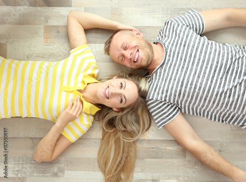 Beautiful couple lying on w...