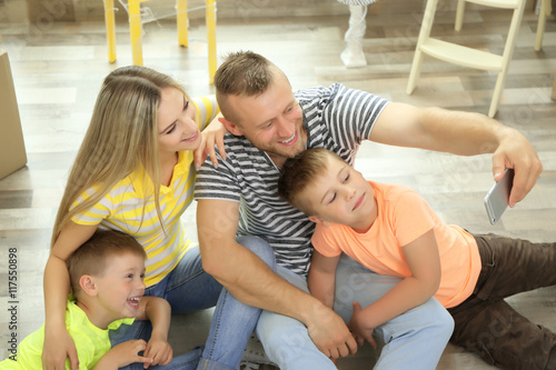 Happy family taking photo w...
