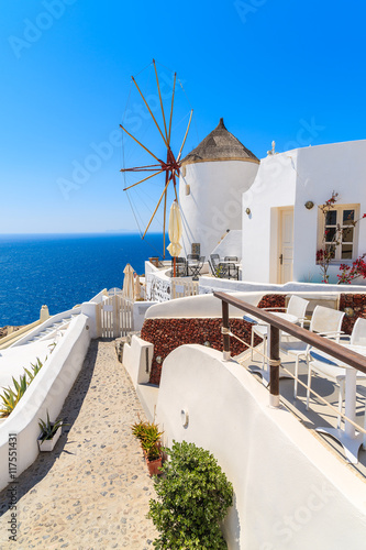 View of famous windmill in Oia village, Santorini island, Greece