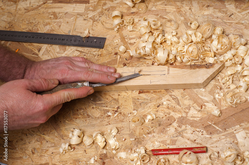 Carpenter working. Carpenter tools on wooden table with sawdust.