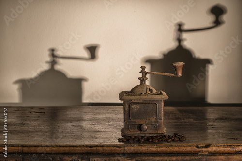 Old coffee grinder on old wood Trunk