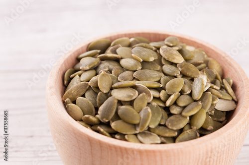 shelled pumpkin seeds isolated on white background