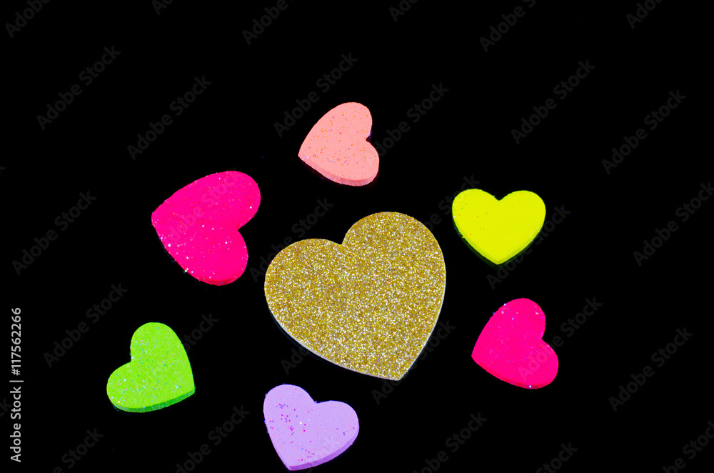 Fototapeta premium Heart of gold many colors Black background