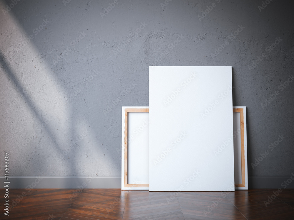 Two white canvases on the wooden floor. 3d rendering Two white canvases on the wooden floor. 3d rendering