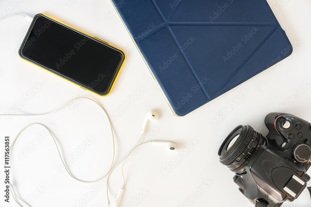 Fototapeta premium travel accessories on table with camera to be packed . traveling