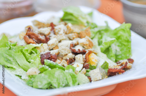 caesar salad or vegetable salad with bacon