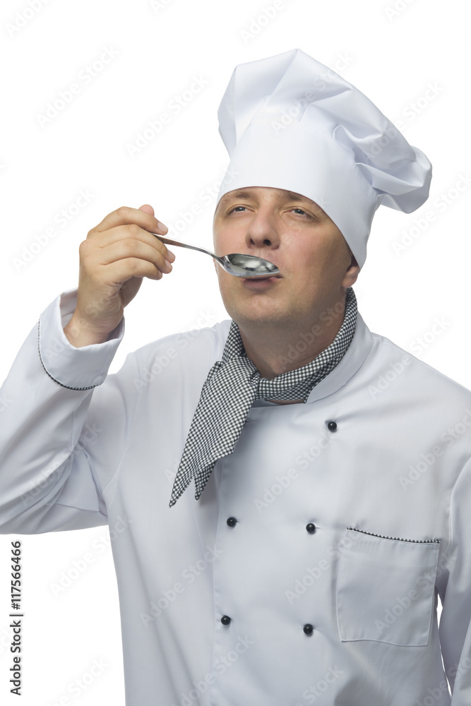 Chef tries meal from a spoon Chef tries meal from a spoon