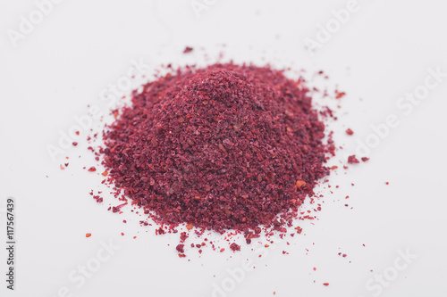 Φωτογραφία Sumac spice on white background