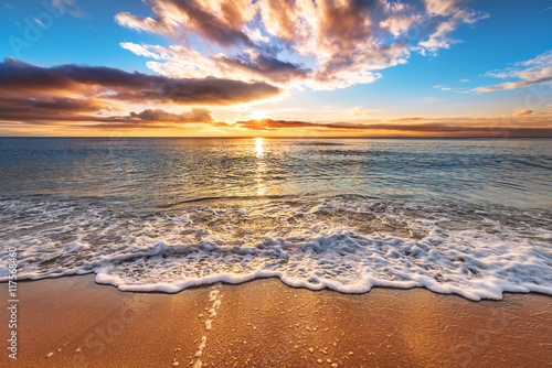 Colorful ocean beach sunrise.