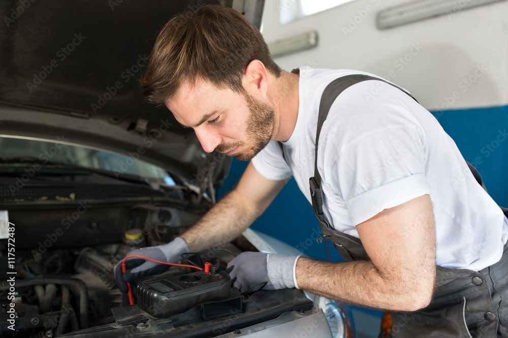 Mechanic testing electronics Mechanic testing electronics
