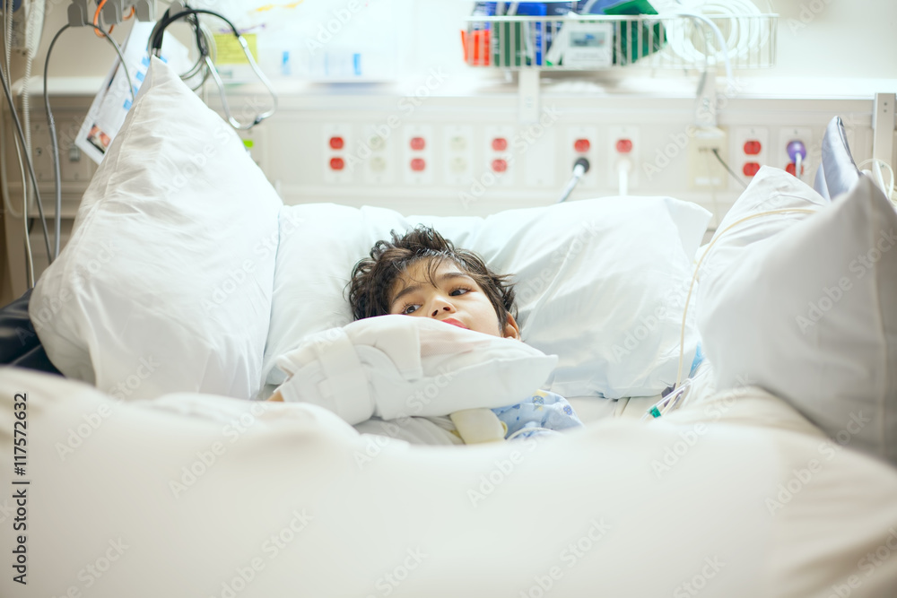 Disabled little boy lying sick in hospital bed Stock Photo Adobe Stock
