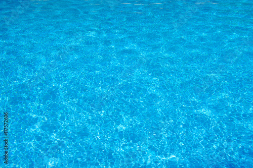 Swimming pool blue water surface texture