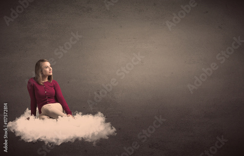 Woman sitting on a cloud with plain bakcground