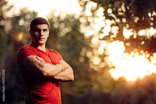 Handsome Athletic Man Standing Outside in Nature