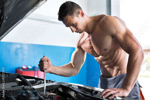 Handsome muscular mechanic photo