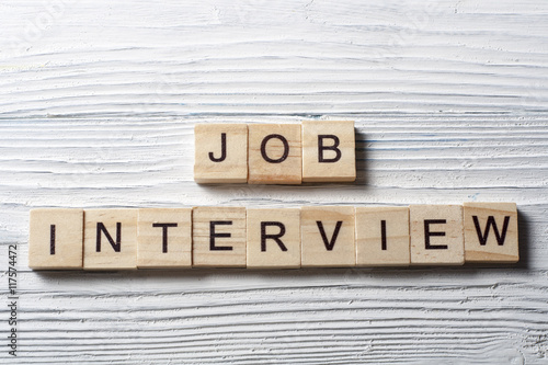 Job Interview word written on wood block. Wooden Abc.