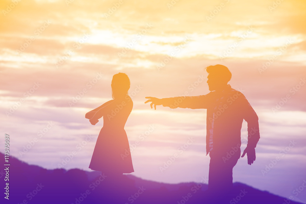 Silhouette of a angry woman and man on each other