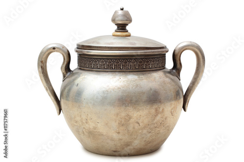 Old metal pot on a white background