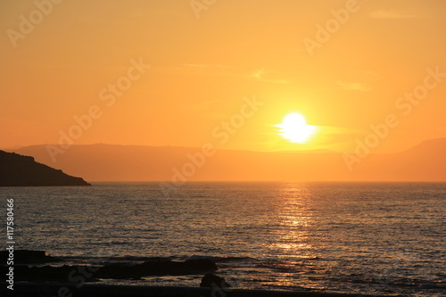 Bright orange sunset in the Mediterranean Sea in Greece © zeflue