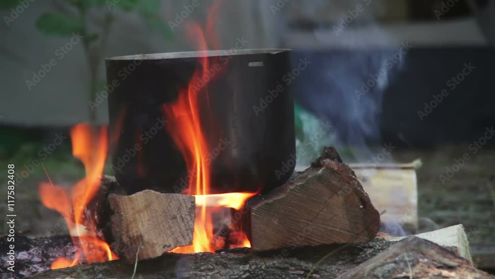 Cooking Food over a Campfire at the Tourist Pot