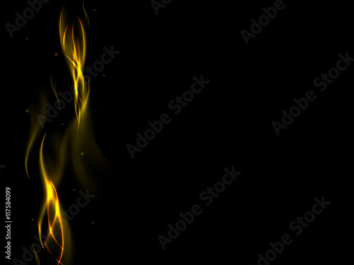 Abstract golden fire flames on black background with sparks