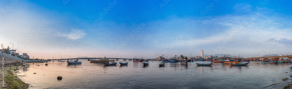 Vietnam, Nha Trang. May 3, 2015. Panorama. Fishing village early in the morning. Ships and boats. Bridges over the river Cai.