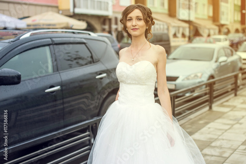 happy bride walks down the street © Artem