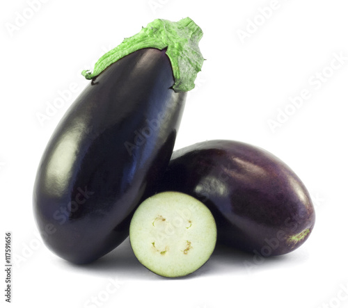 Whole aubergines and slices isolated on white background