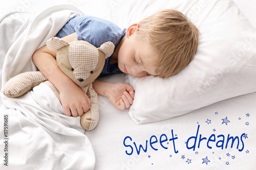 Adorable little boy sleepin...