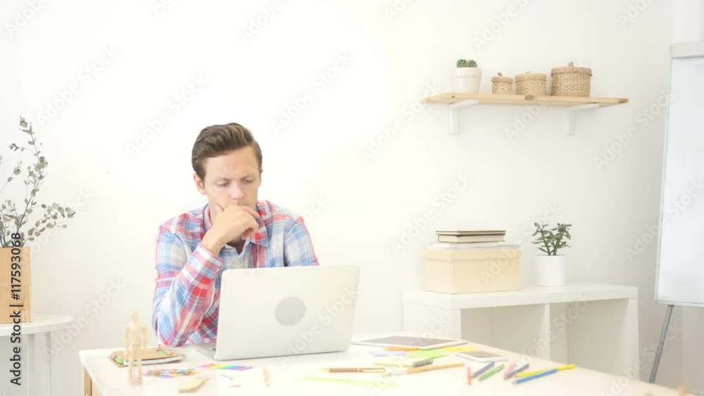 Waiting for inspiration. Thoughtful man holding hand on chin, looking aroud Waiting for inspiration. Thoughtful man holding hand on chin, looking aroud