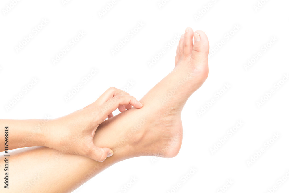 Woman hand scratching on feet with white backgroud for healthy concept Woman hand scratching on feet with white backgroud for healthy concept