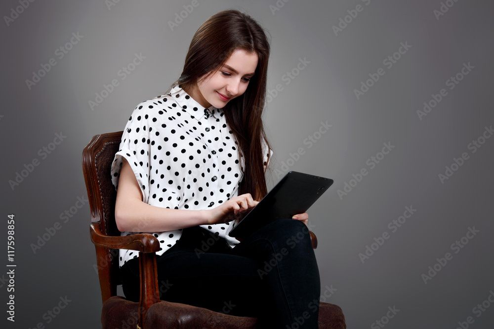 Happy Young Beautiful Girl in white blouse Using Laptop Happy Young Beautiful Girl in white blouse Using Laptop