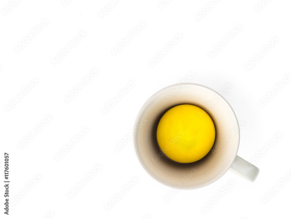 Yellow ball and empty mug on white background, happy and relax concept