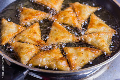Chicken samosas deep fried.