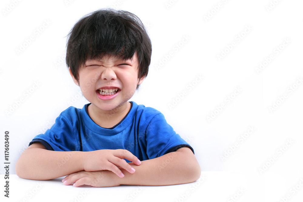 Little asian boy looking cheeky, with a fun expression isolated on white Little asian boy looking cheeky, with a fun expression isolated on white