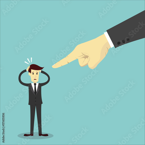 Hand pointing to blame businessman