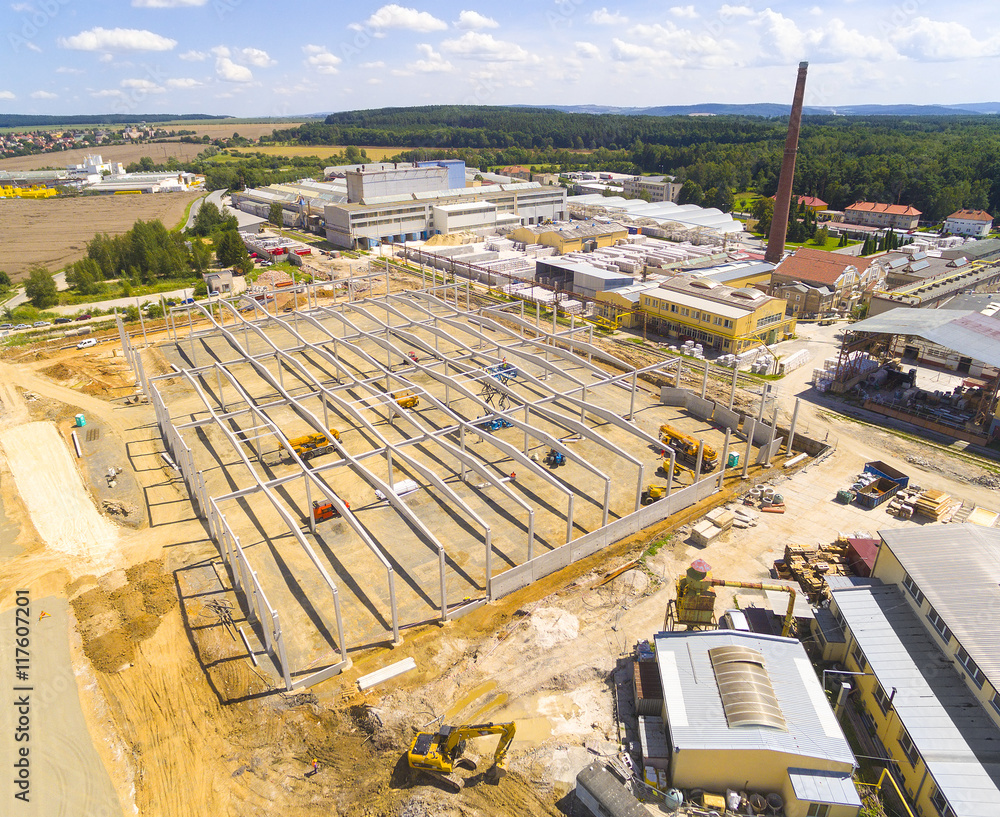 Aerial view of industrial zone with new construction site. Industry