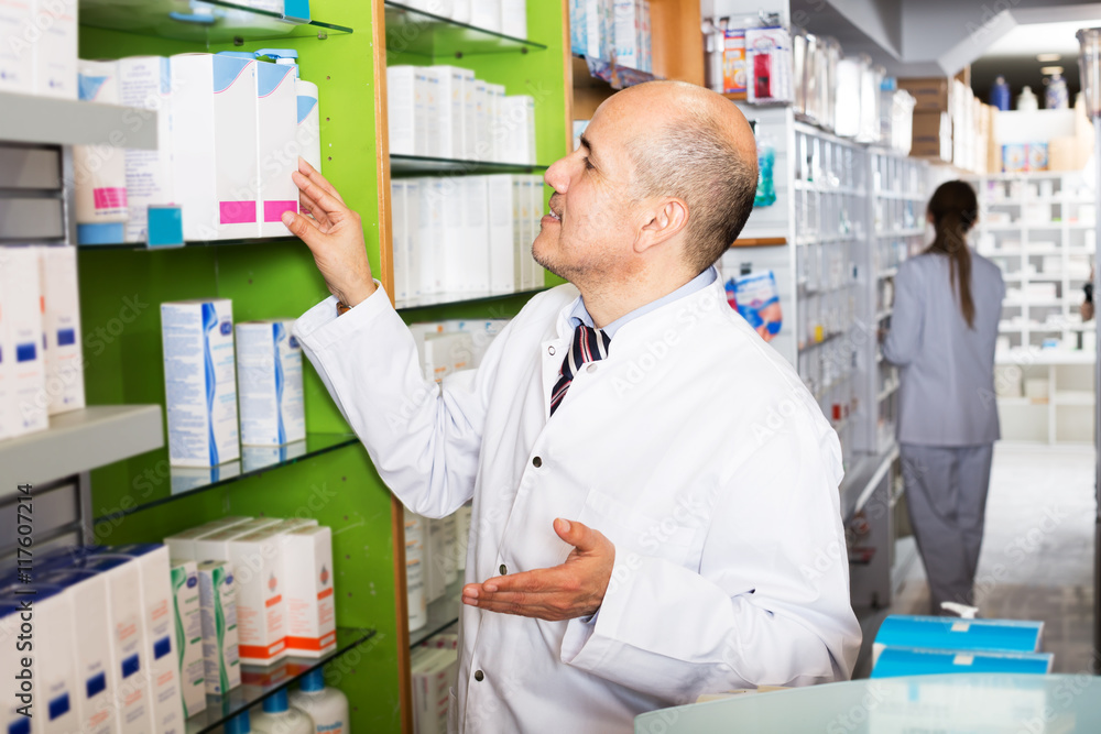 Two pharmacists in chemist shop