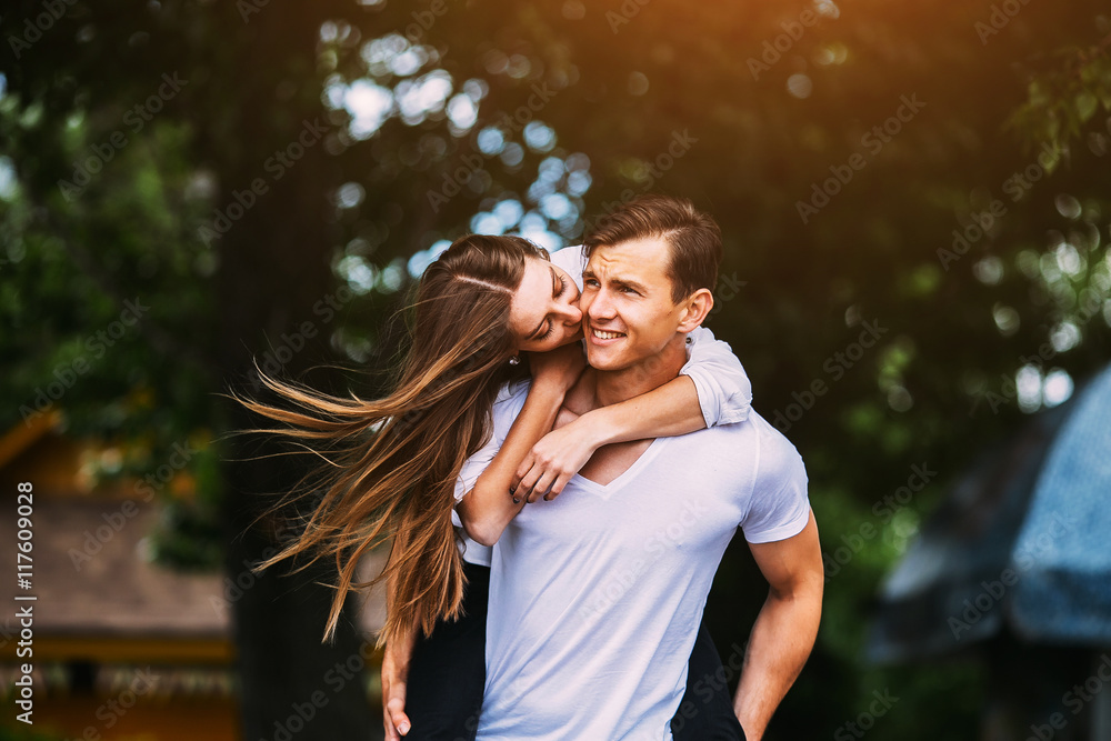 Young adult brunette man and woman in the park Young adult brunette man and woman in the park