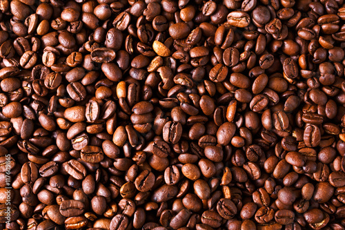 brown roasted coffee beans close up background, texture