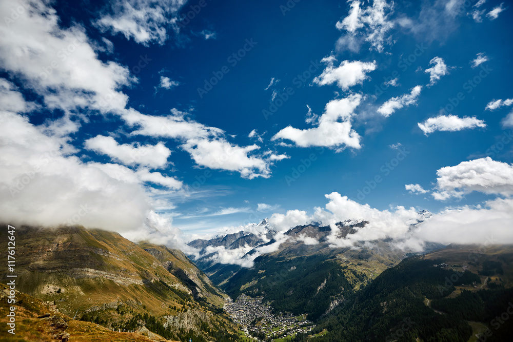 Snow capped alpine mountains. Trek near Matterhorn mount.