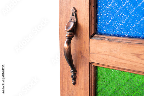 used to open the door catch,door handles color Vintage glass,Part of the wooden door, isolated on white background