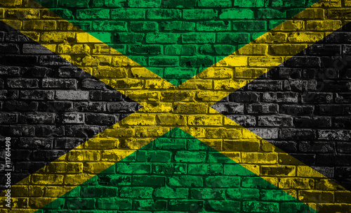 Flag of Jamaica on old brick wall background