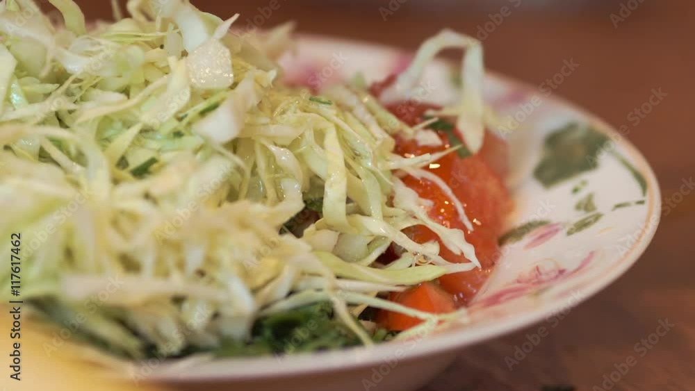 oil poured into salad oil poured into salad