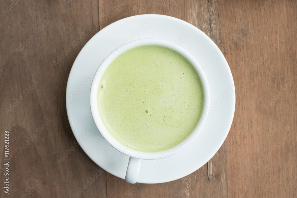 green tea latte on wood background green tea latte on wood background